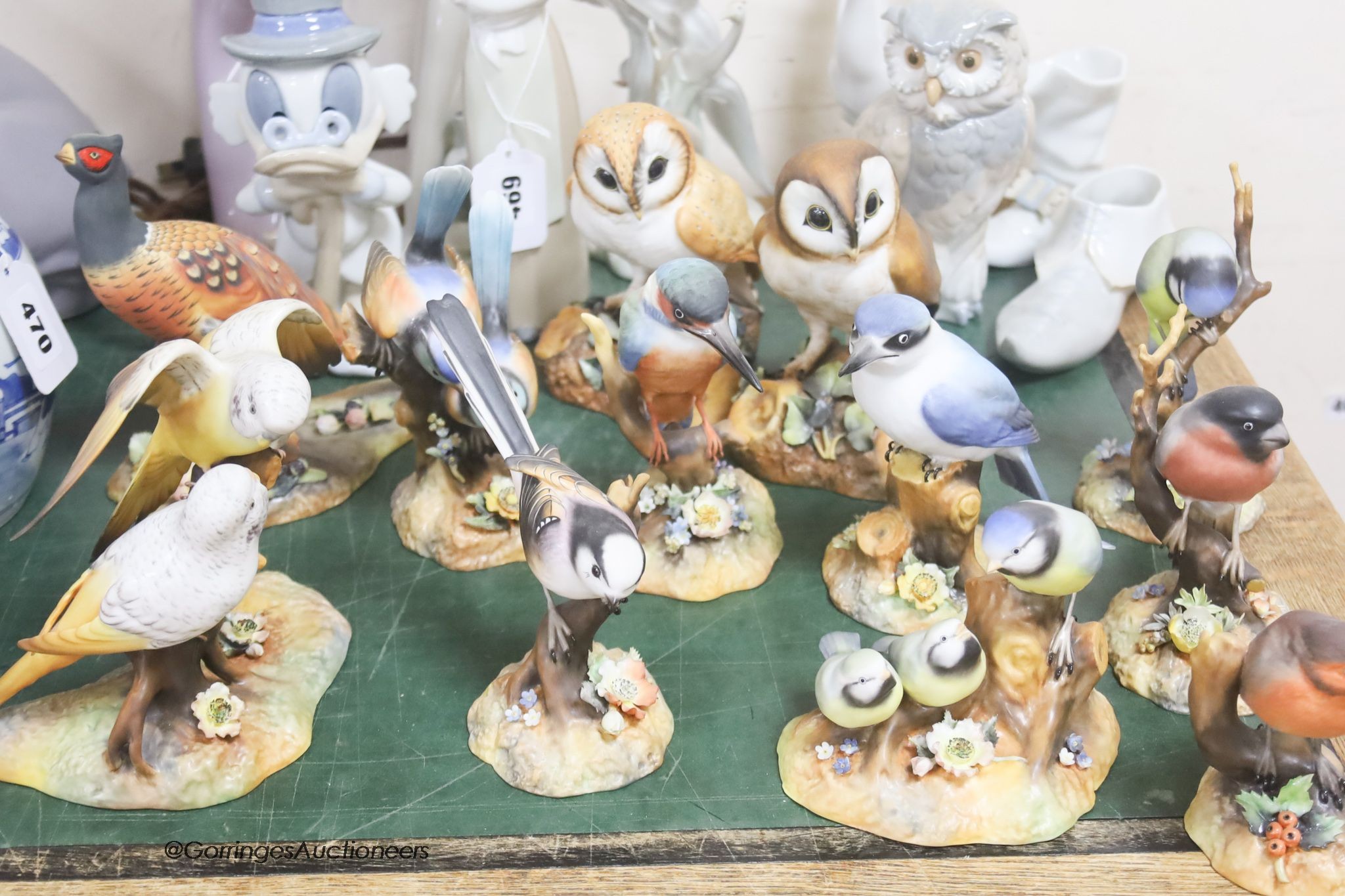 A collection of Royal Crown Derby models of birds (with boxes) and a group of Nao figures